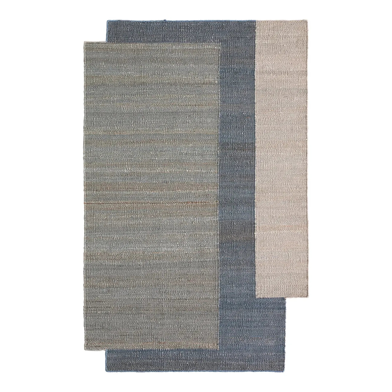 Asymmetrical blue and gray woven jute rug on a white background