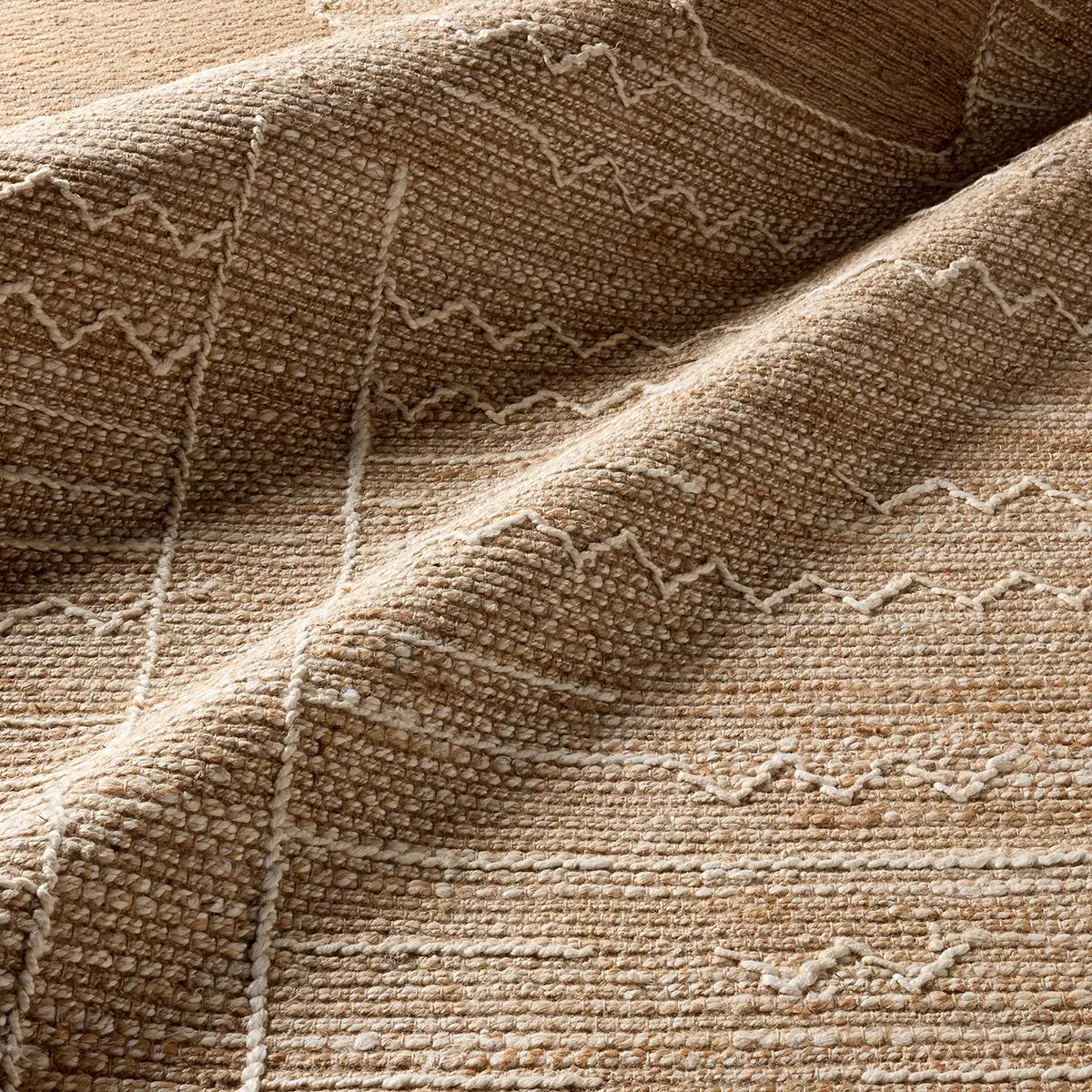 Close-up of a textured brown fabric with geometric pattern