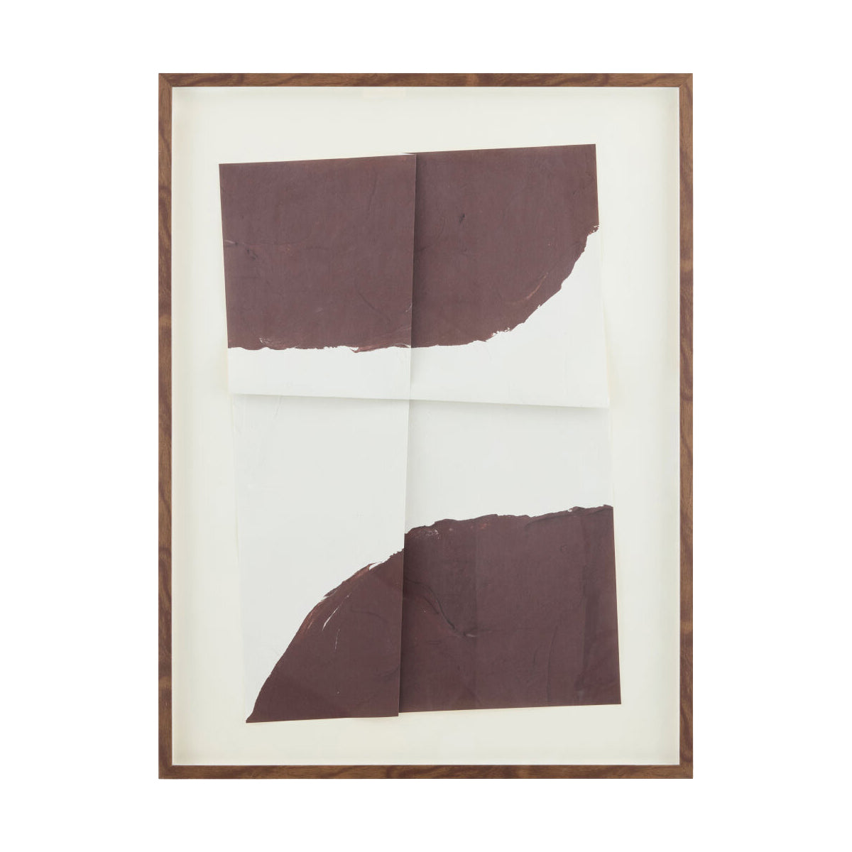 A framed abstract art print featuring two large, textured dark brown paper shapes on a white background, enclosed in a white mat and a thin brown wooden frame.