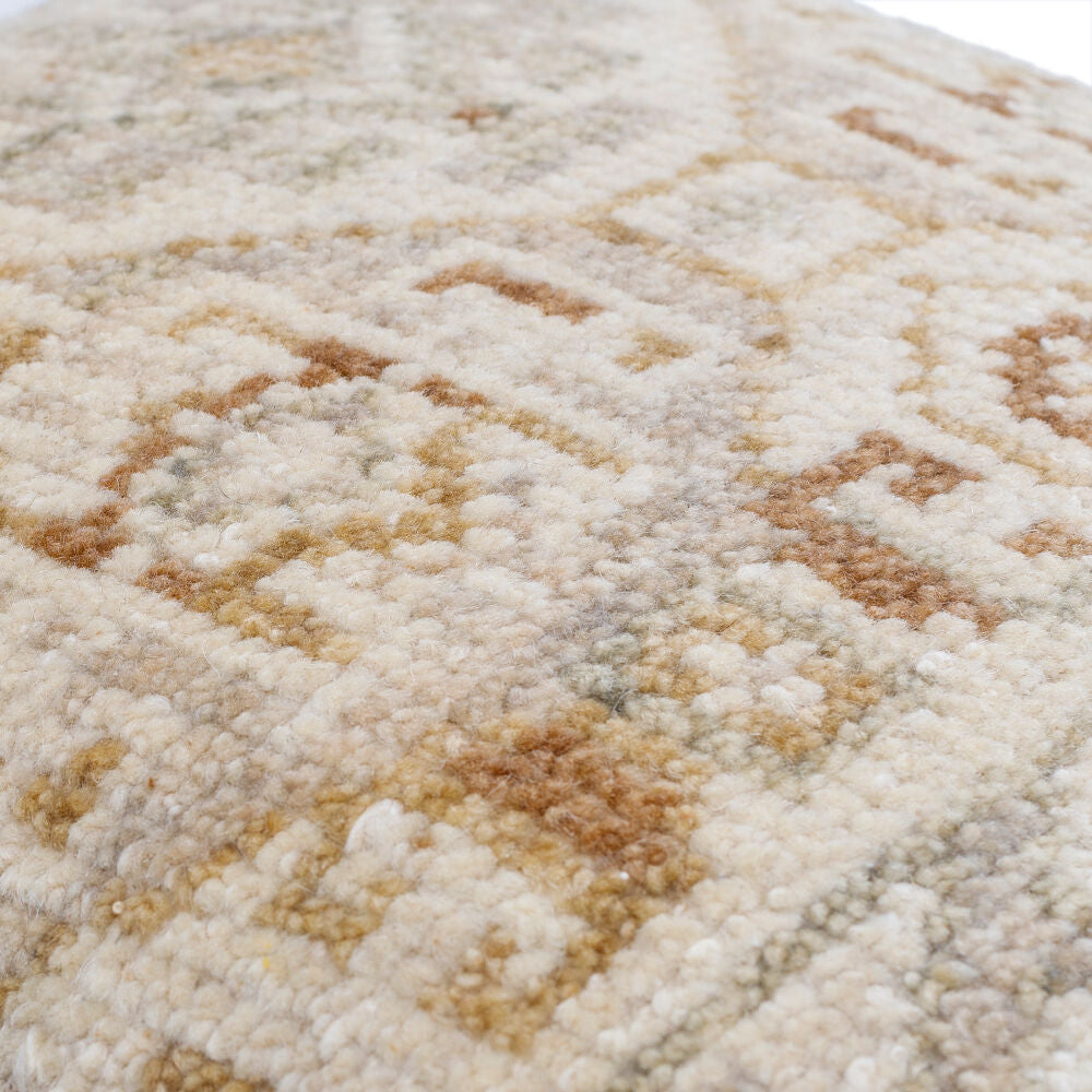Close-up of a textured beige and brown carpet