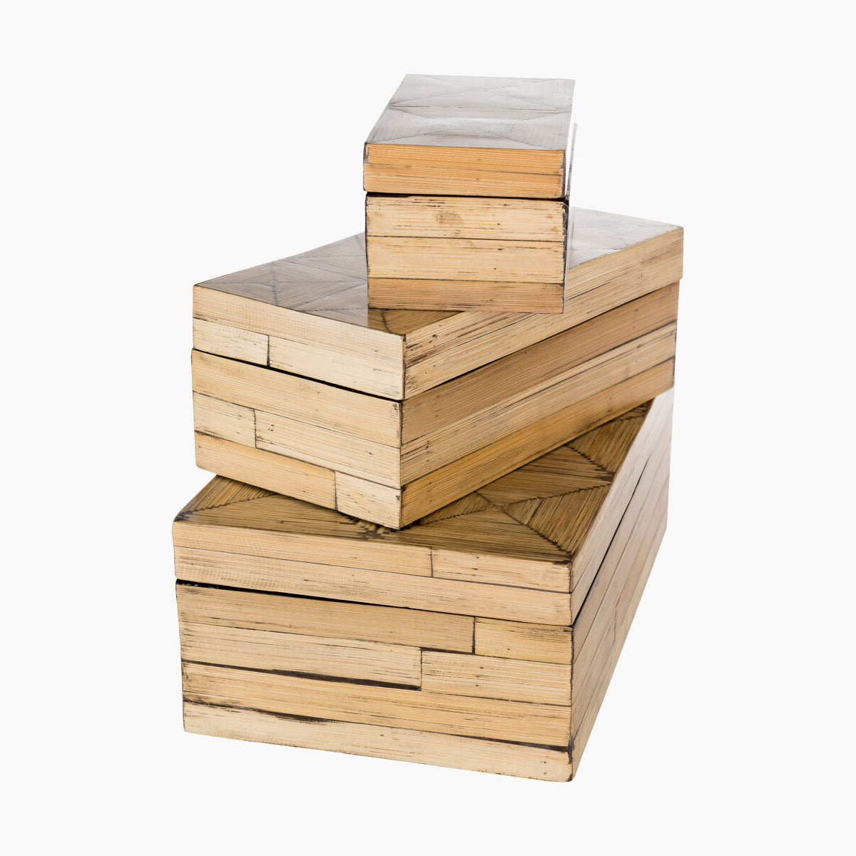 Stack of wooden boxes with a geometric pattern on a white background