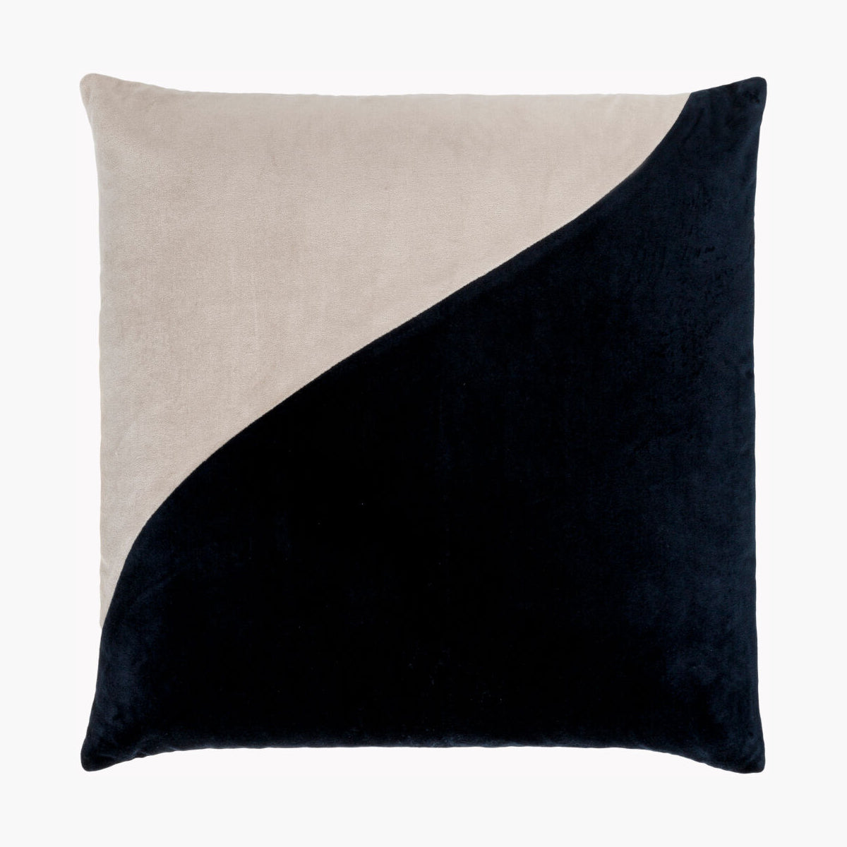 Two-tone pillow with beige and black sections on a white background