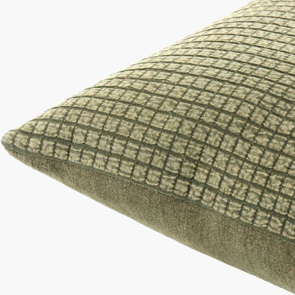 Green checkered pillow on a white background