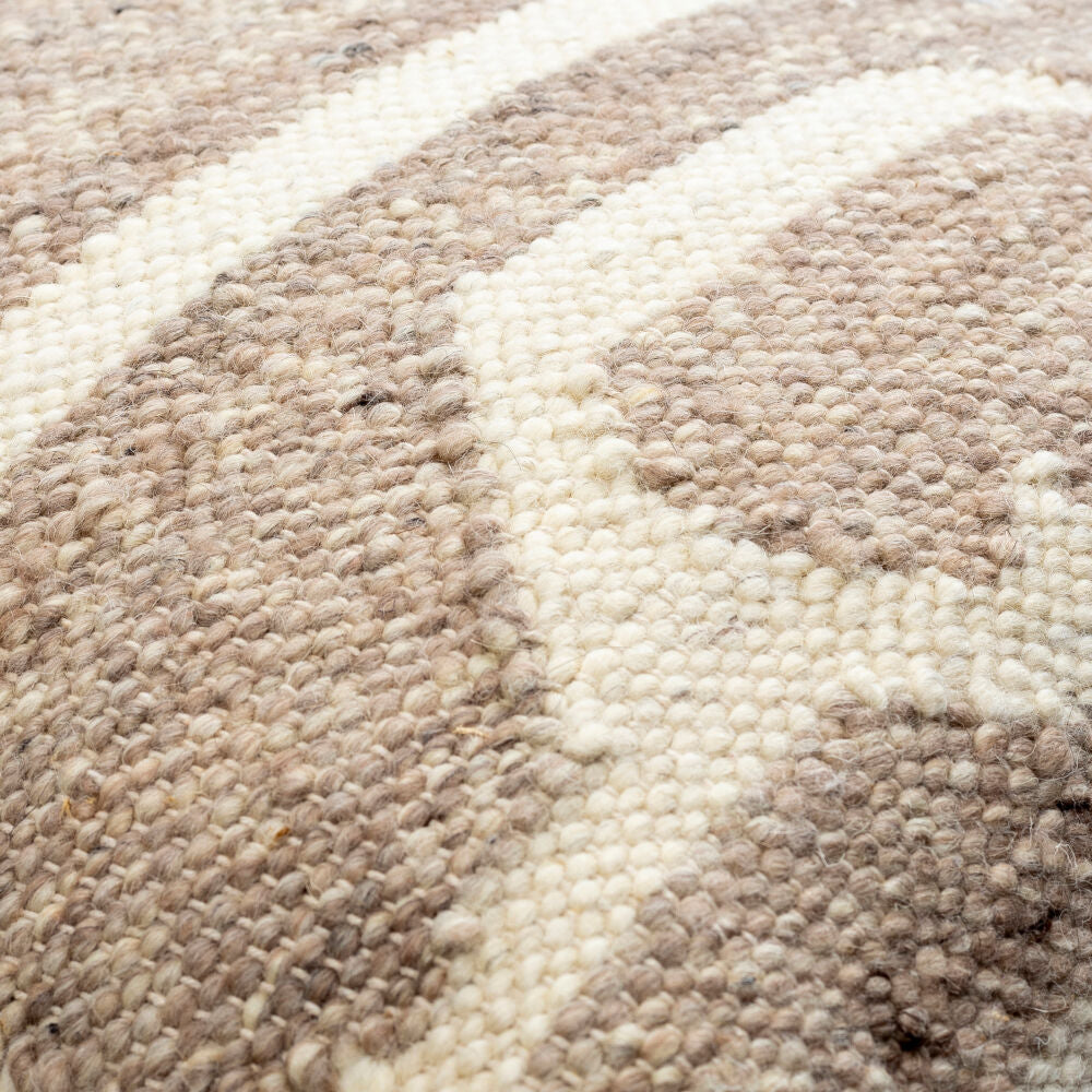 Close-up of a textured beige and white carpet