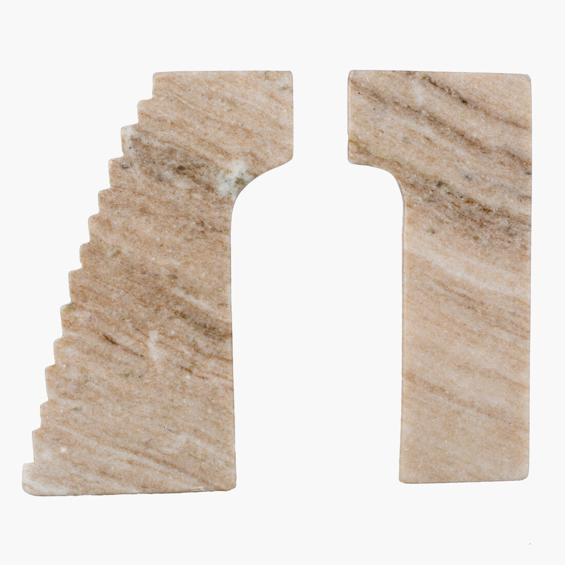 Two beige stone bookends with stair design on a white background