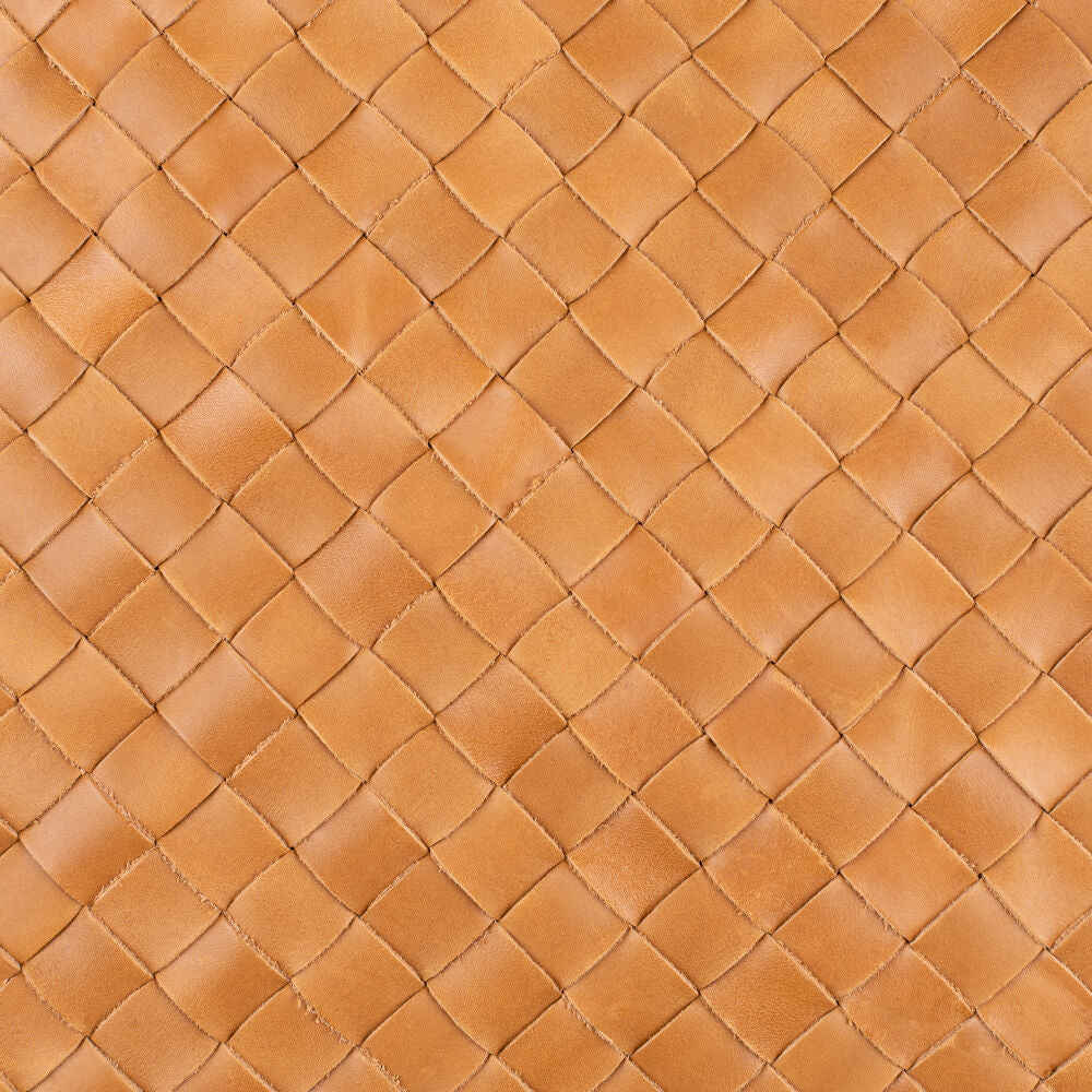 Close-up of a brown woven leather texture