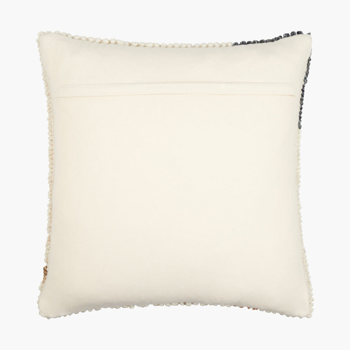 White pillow with textured trim on a white background