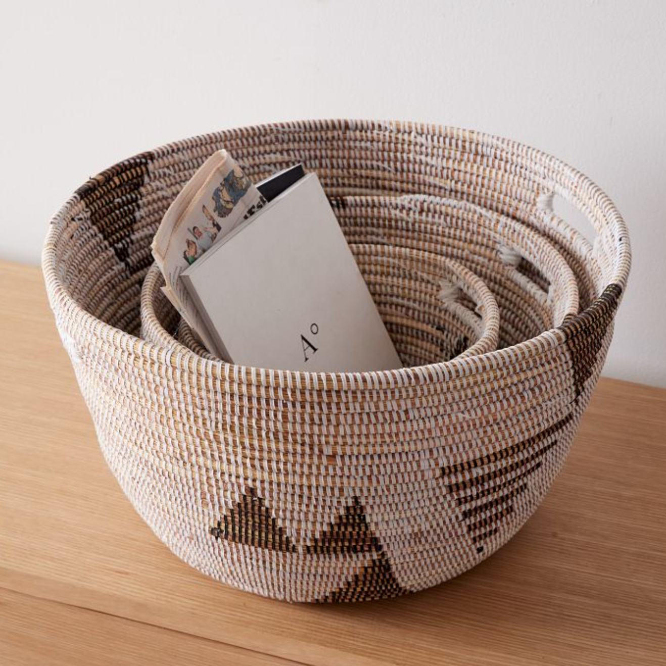 Woven basket with pattern on a wooden surface