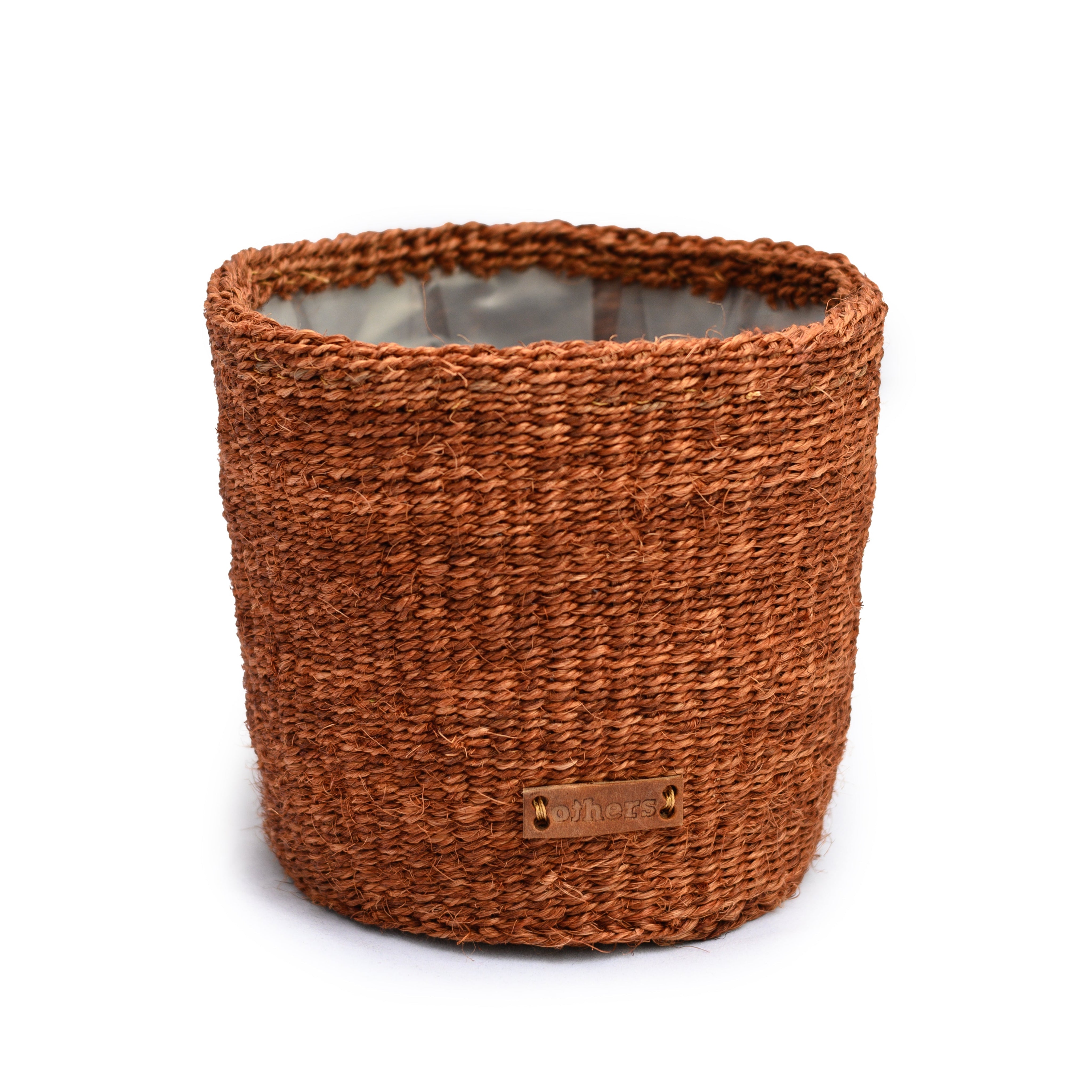 Brown woven flower pot with a visible brand label on a white background