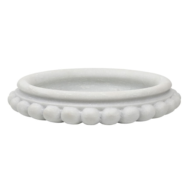 White ceramic dish with bead-like design on a white background