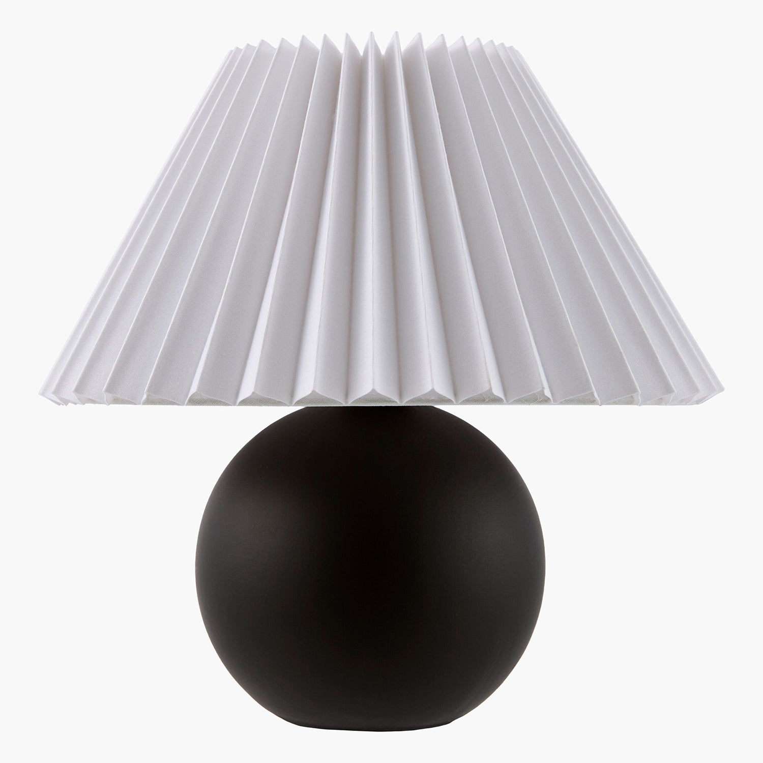 Table lamp with a pleated white shade and round black base on a white background