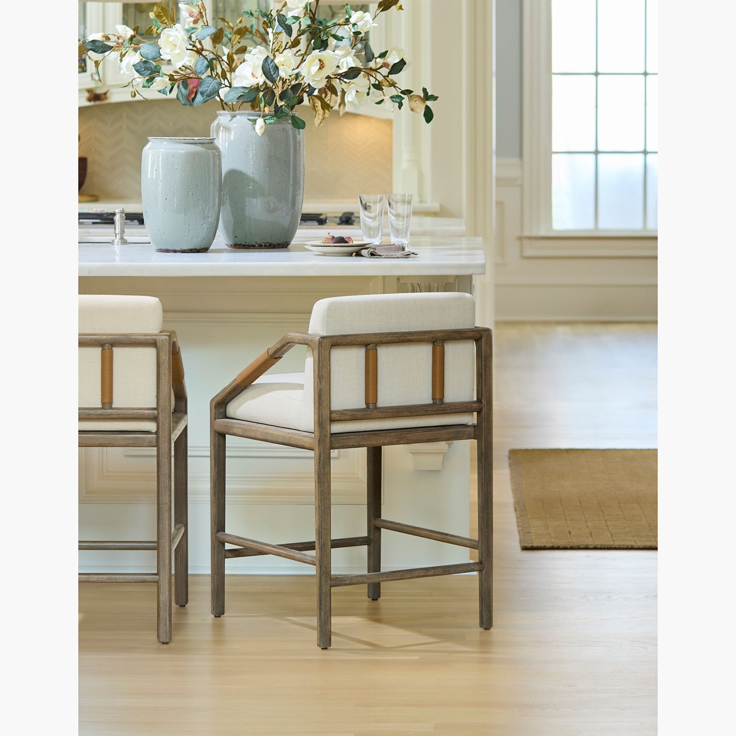 Dining area with wooden chairs, a table, and decorative elements.
