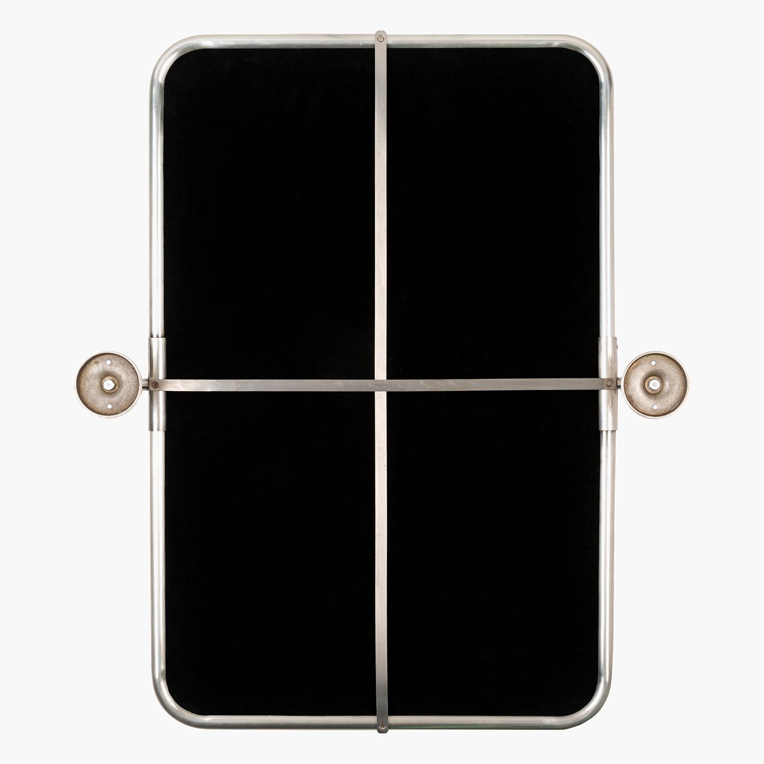 Black rectangular object with metallic frame on a white background