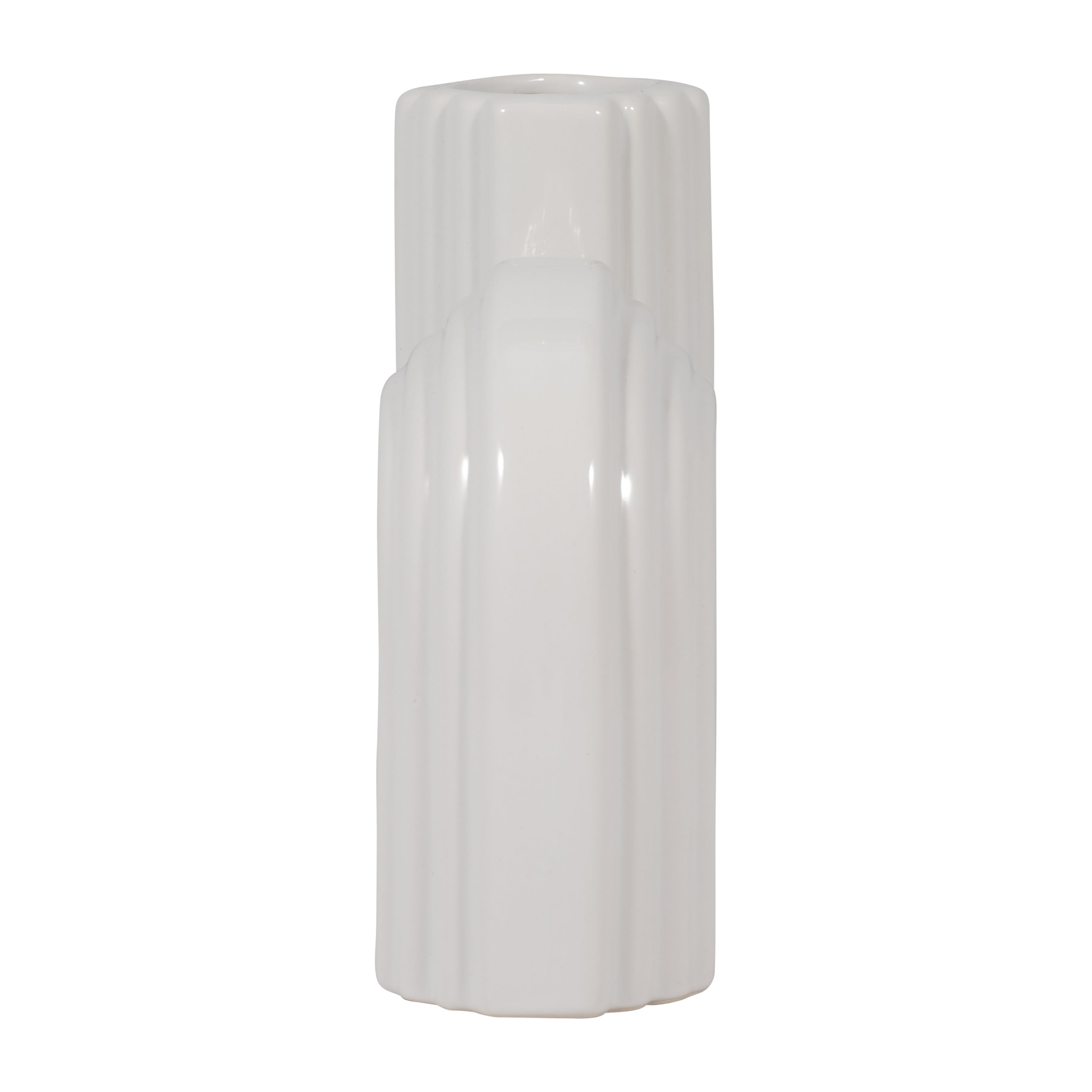White cylindrical object with ribbed texture on a white background