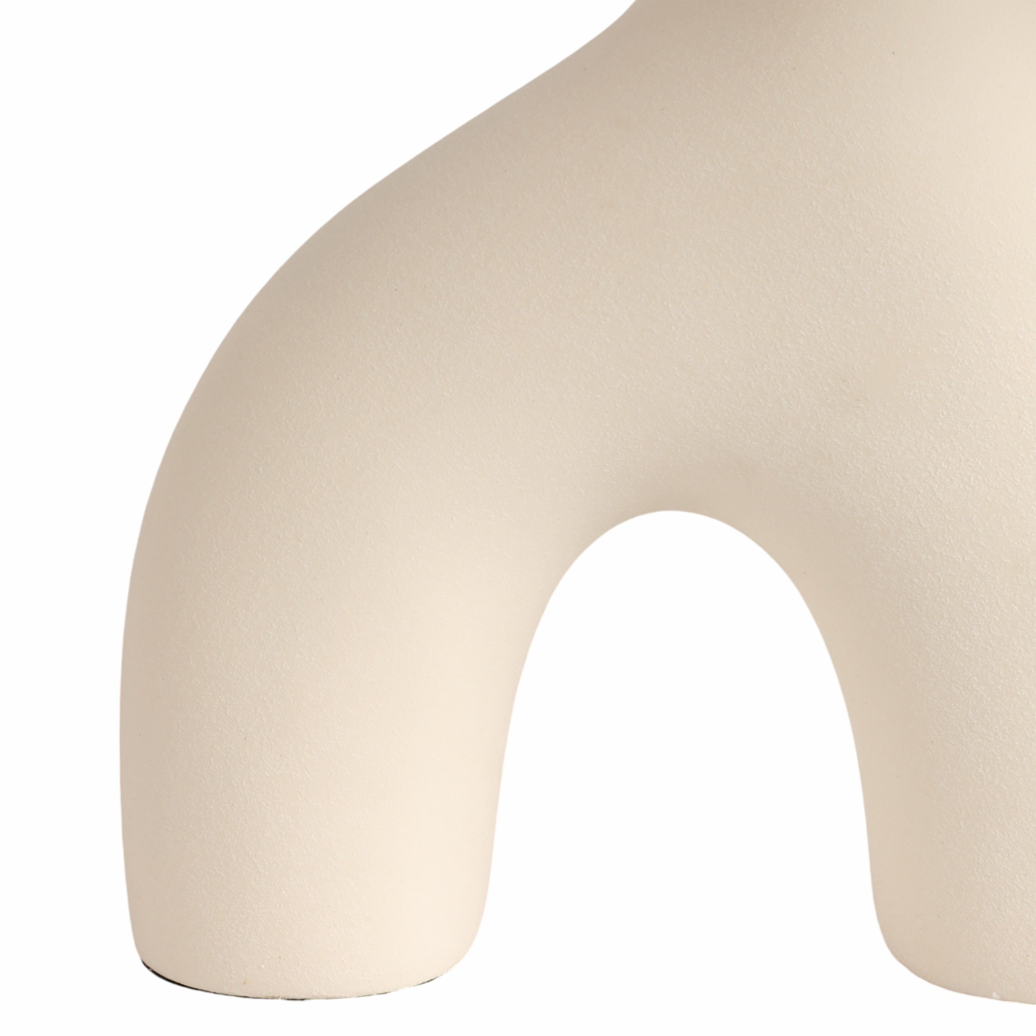 Beige U-shaped pillow on a white background