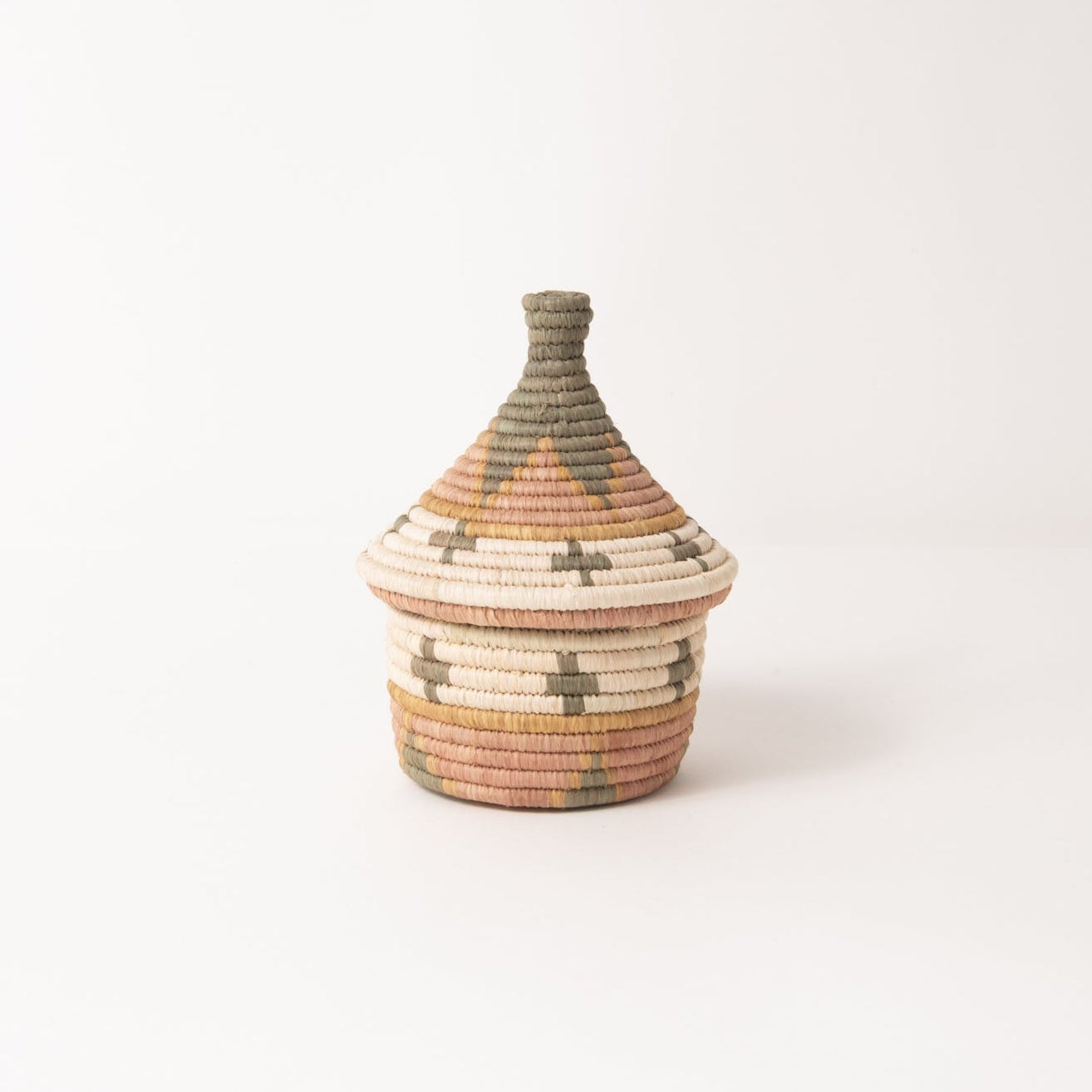 Small woven basket with a textured design on a white background