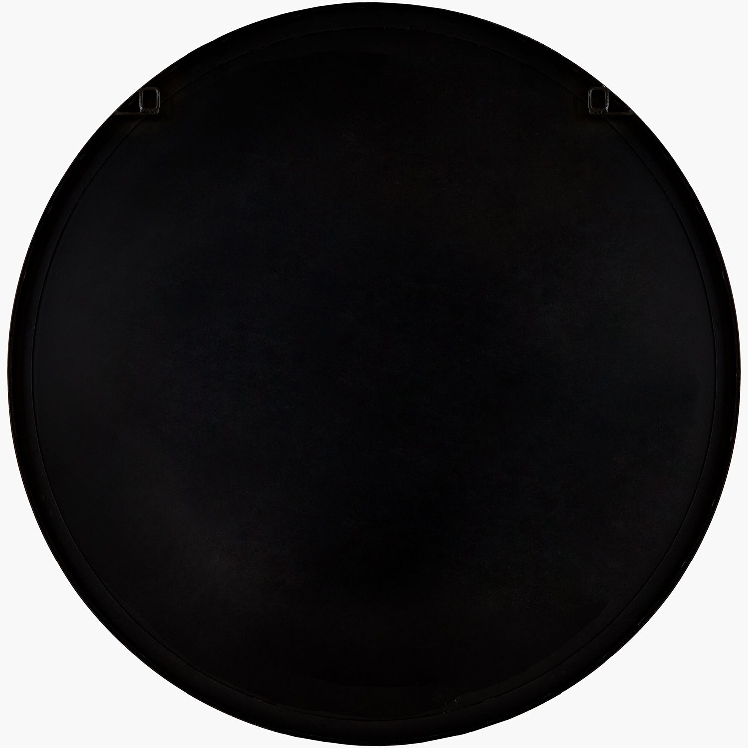 Black circular mirror backing on a white background