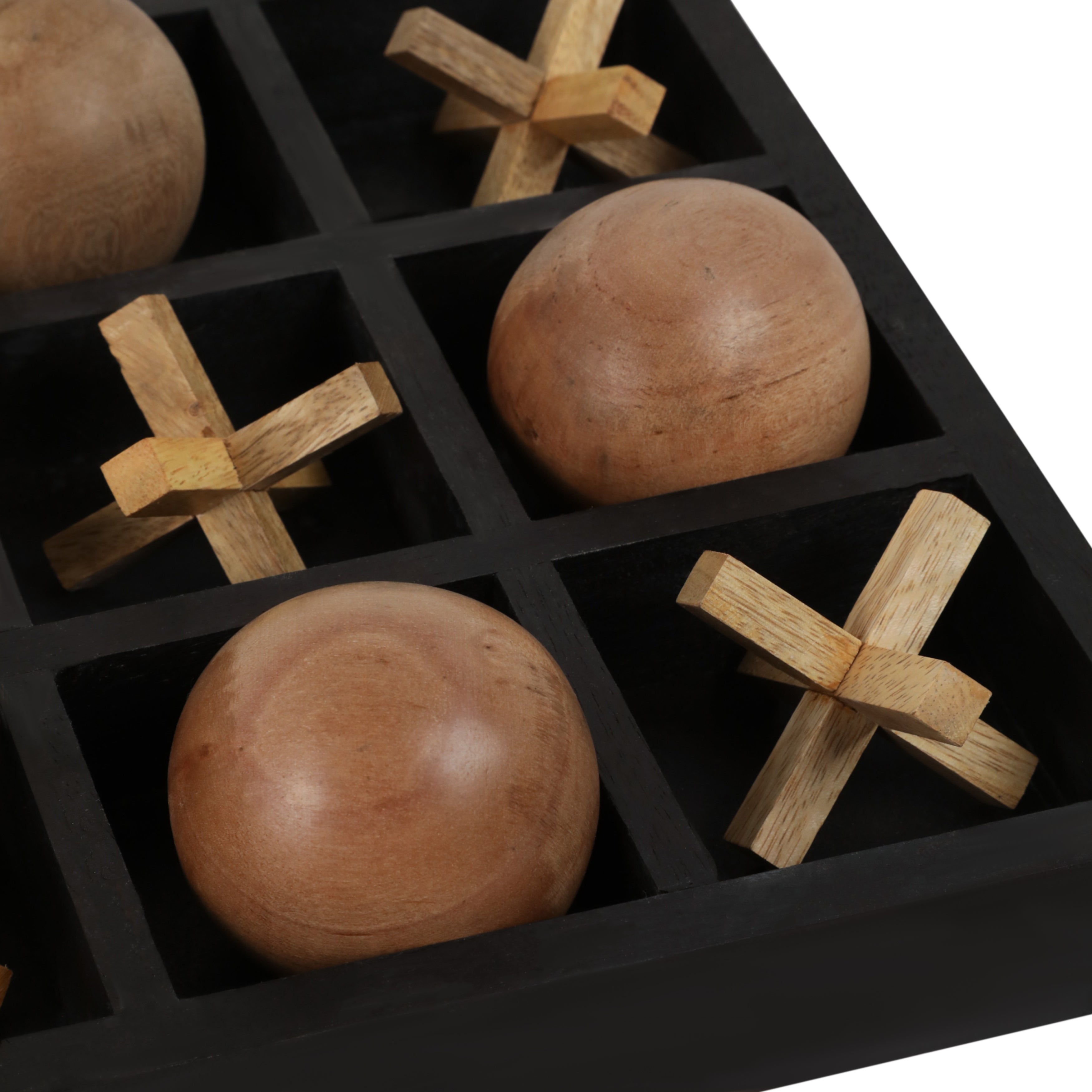 Wooden puzzle with spherical and cross-shaped pieces in a black grid container.