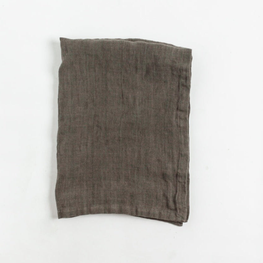 Folded brown fabric on a white background