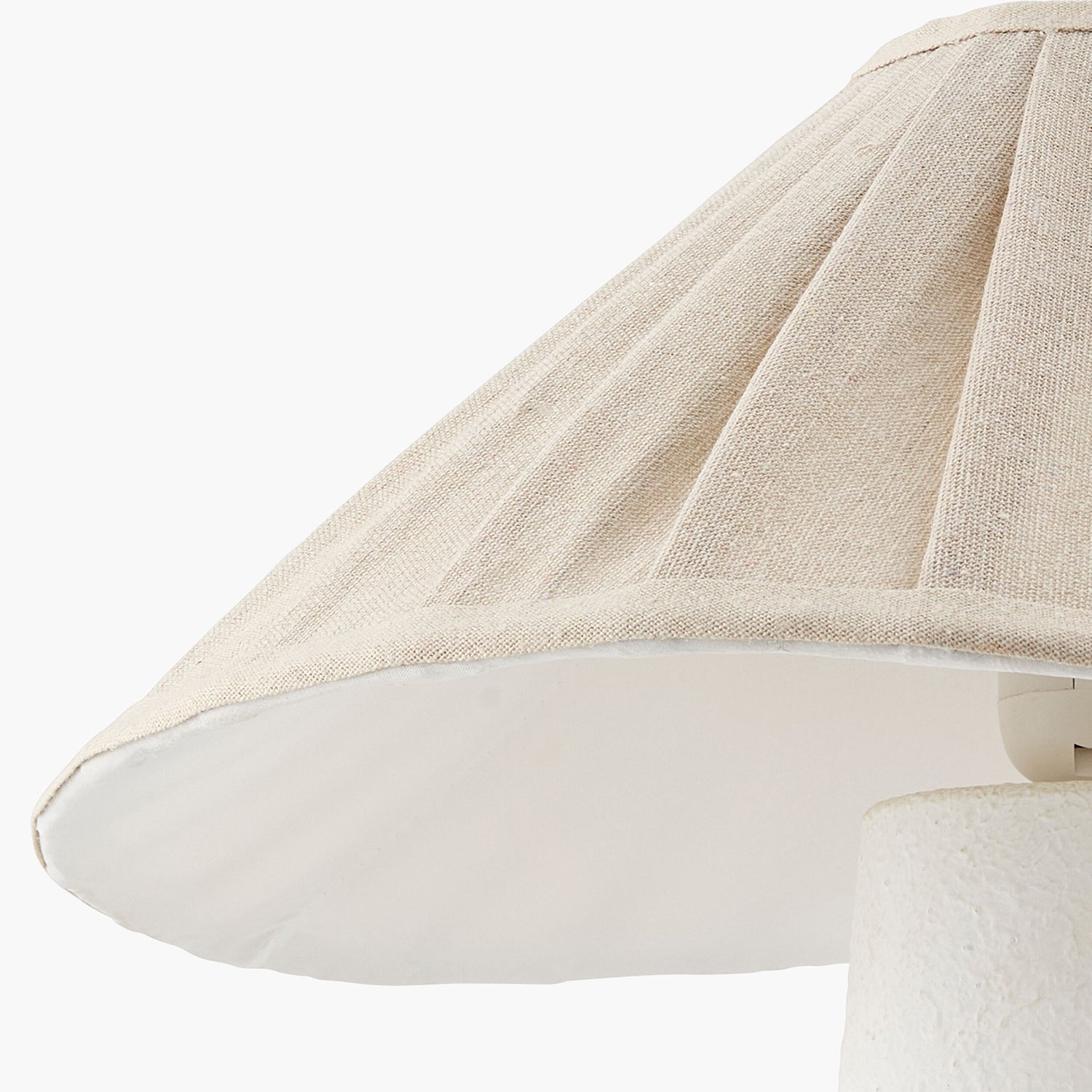 Close-up of a beige lampshade on a white background