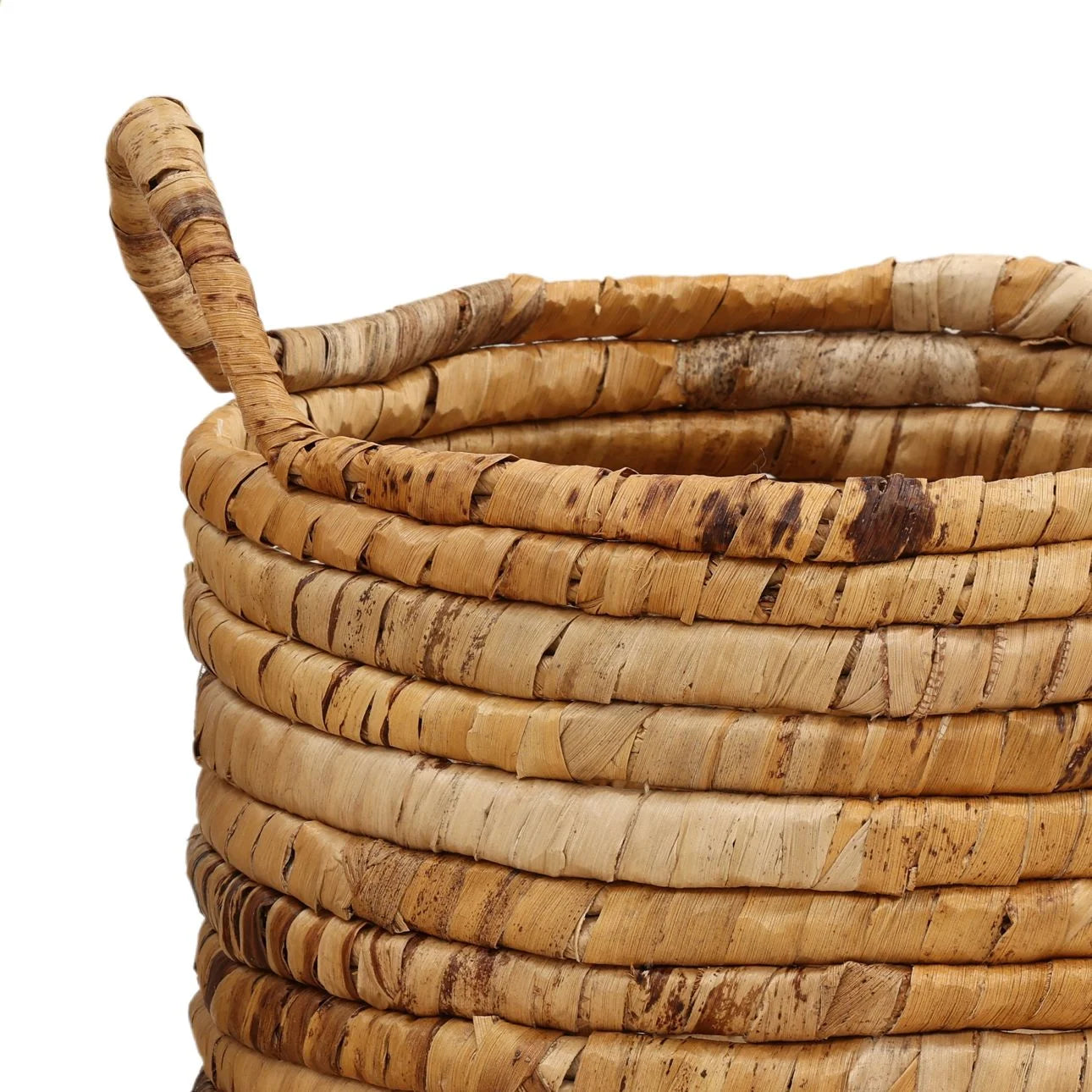Woven basket made of natural materials on a white background