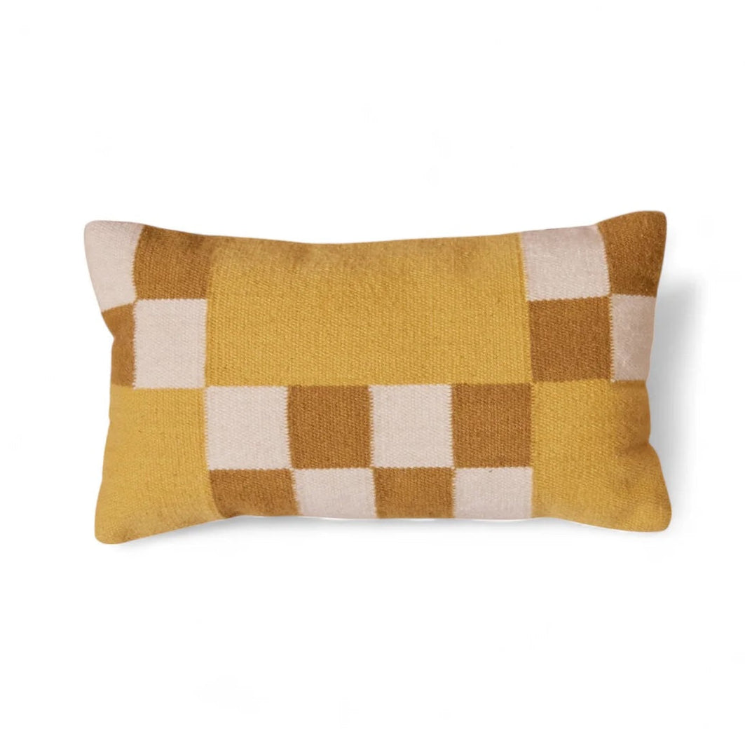 Checkered pillow with yellow and beige pattern on a white background