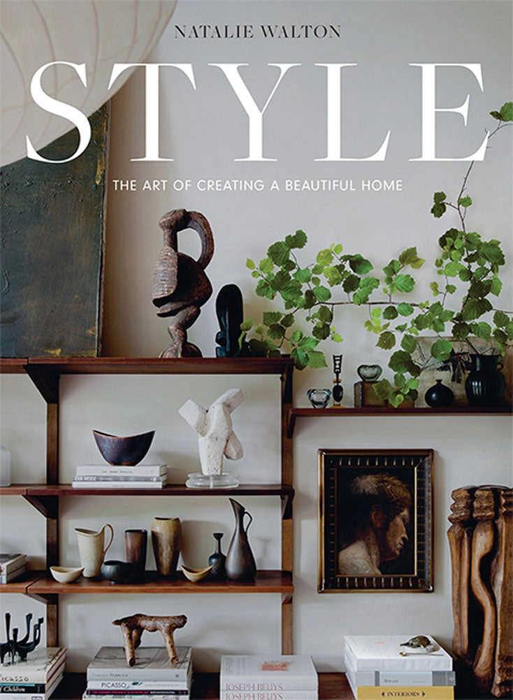 Book cover of 'Style: The Art of Creating a Beautiful Home' by Natalie Walton with decorative shelves and plants.
