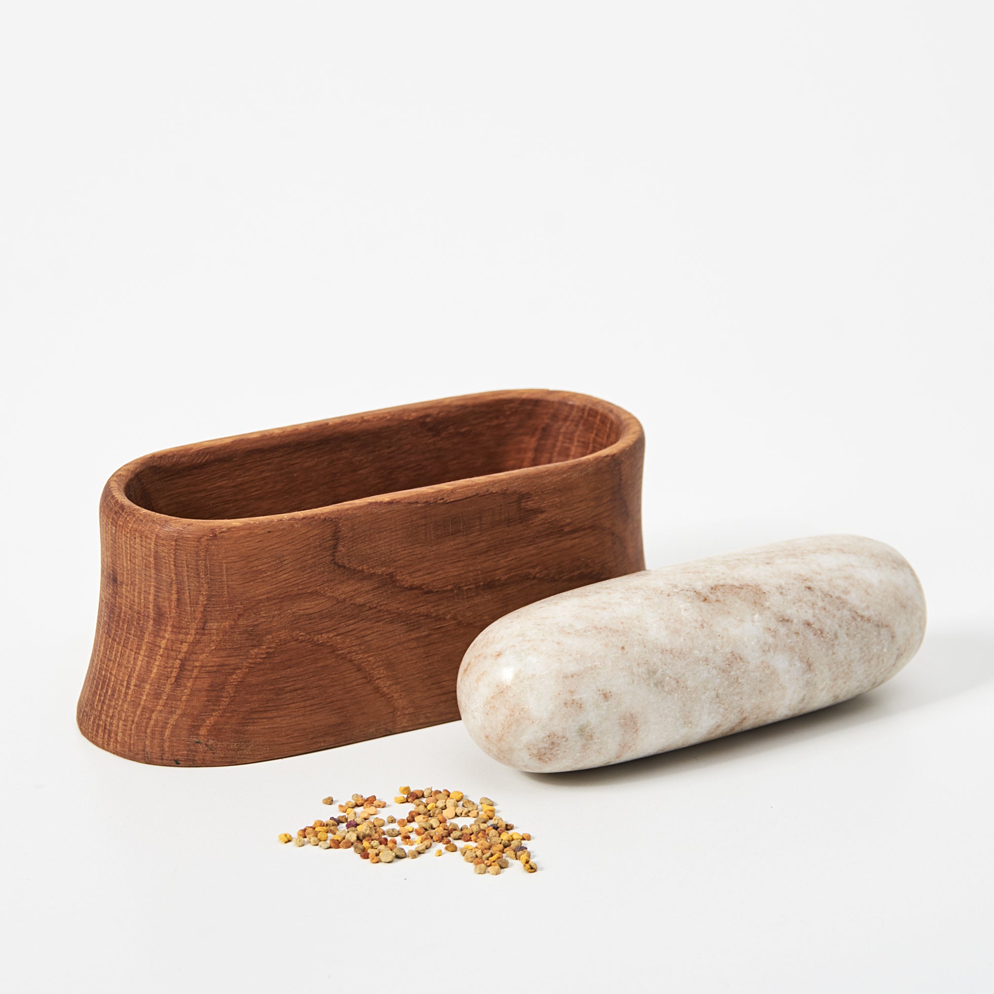 Wooden mortar and marble stone pestle on a white background