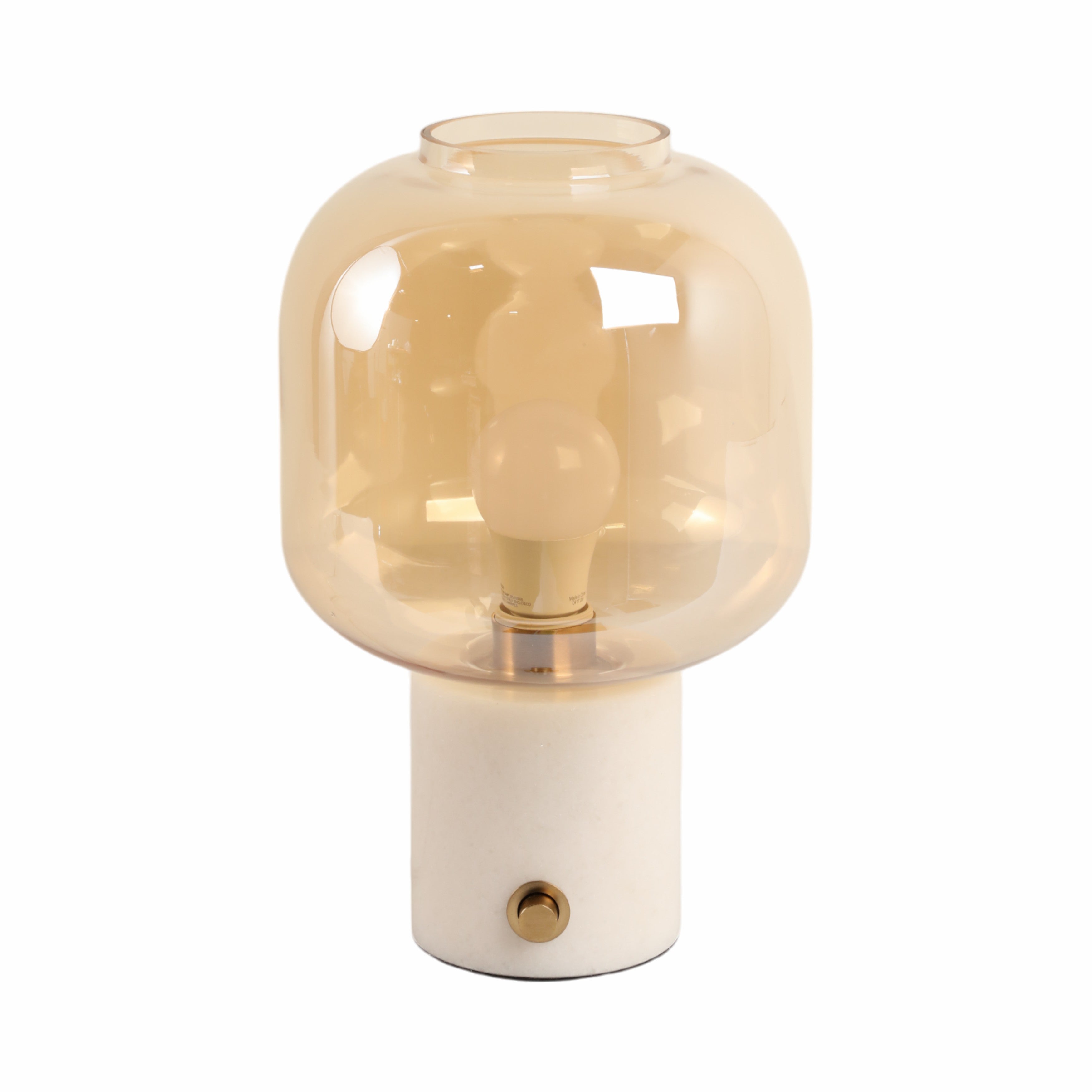 Table lamp with glass shade and white base on a white background