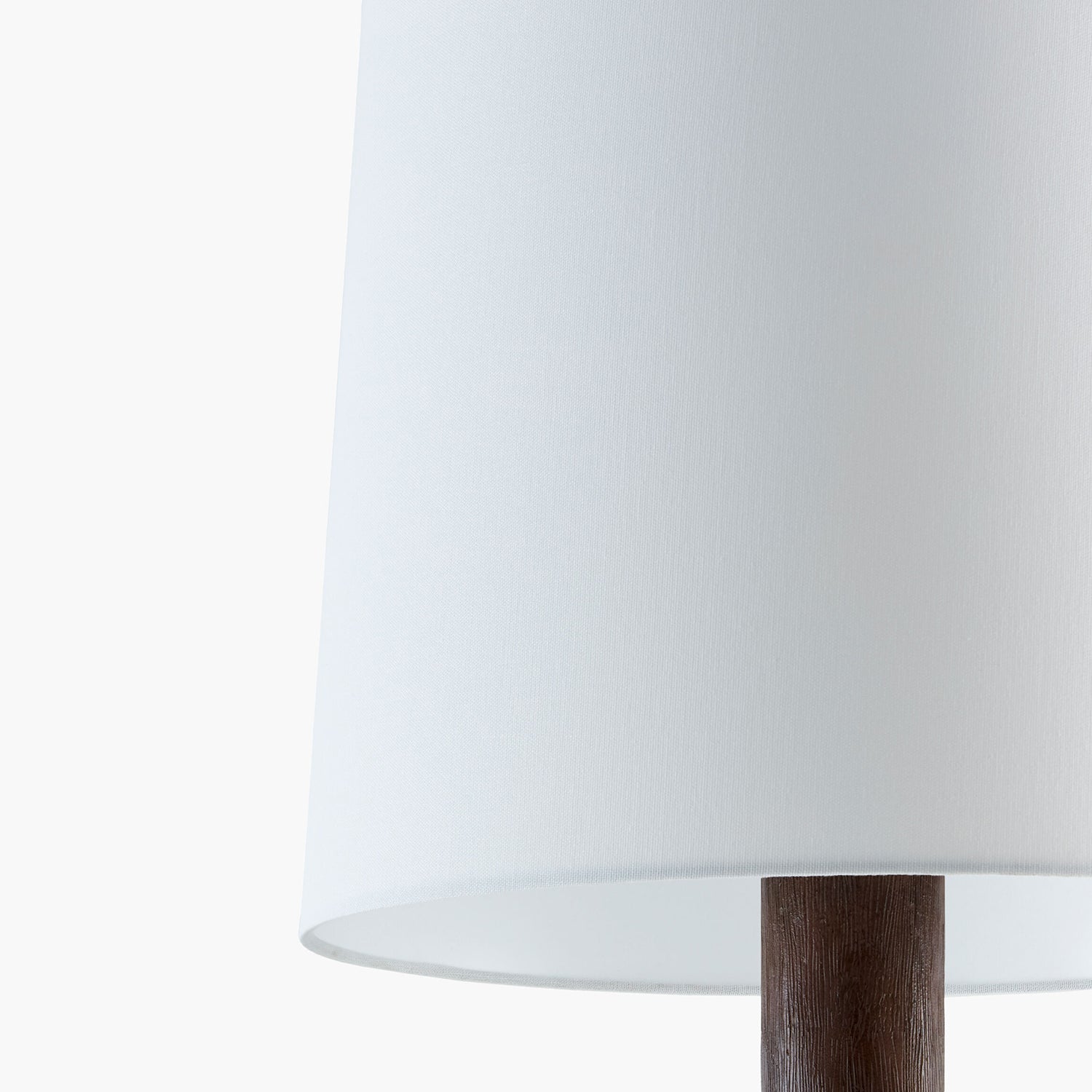White lampshade with a wooden base on a white background