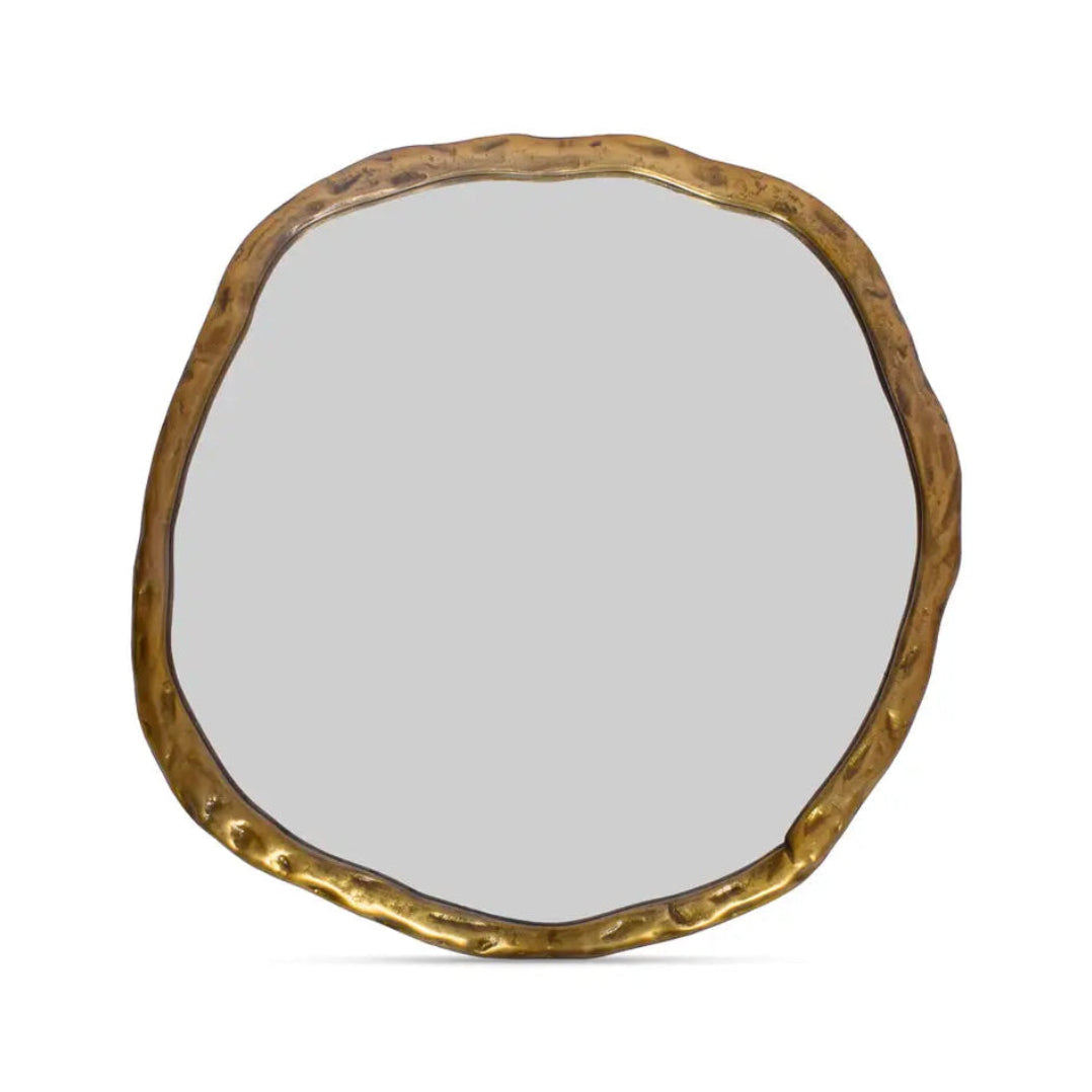 Round mirror with a gold frame on a white background