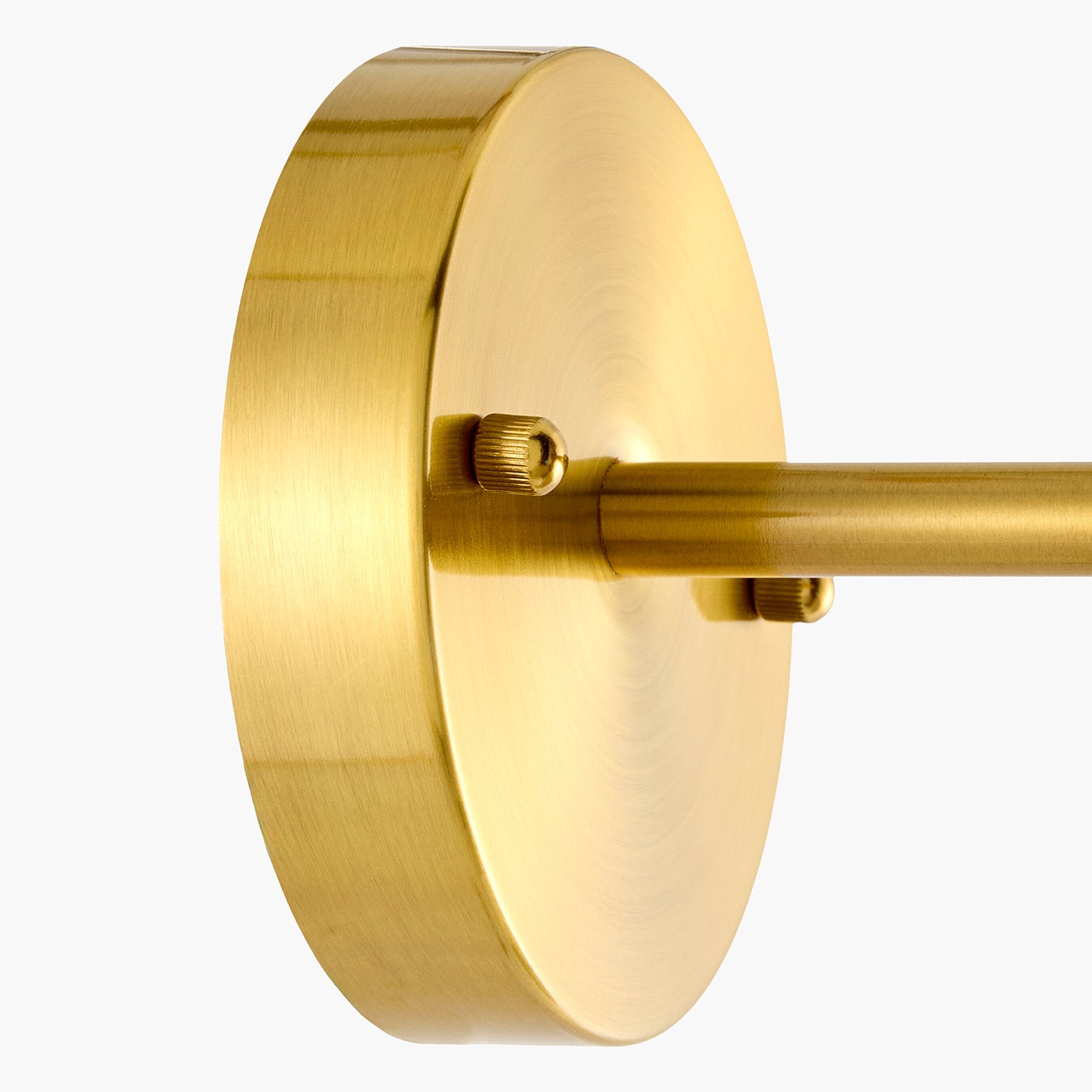 Gold wall-mounted light fixture on a white background