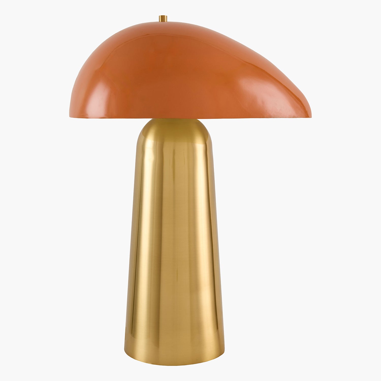 Table lamp with orange shade and gold base on a white background