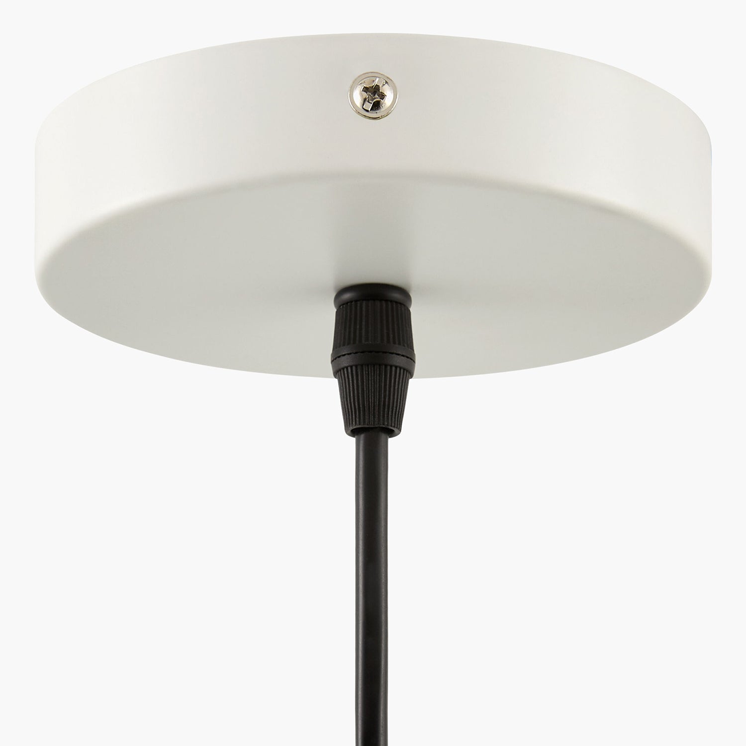 White ceiling light fixture with black cord on a white background