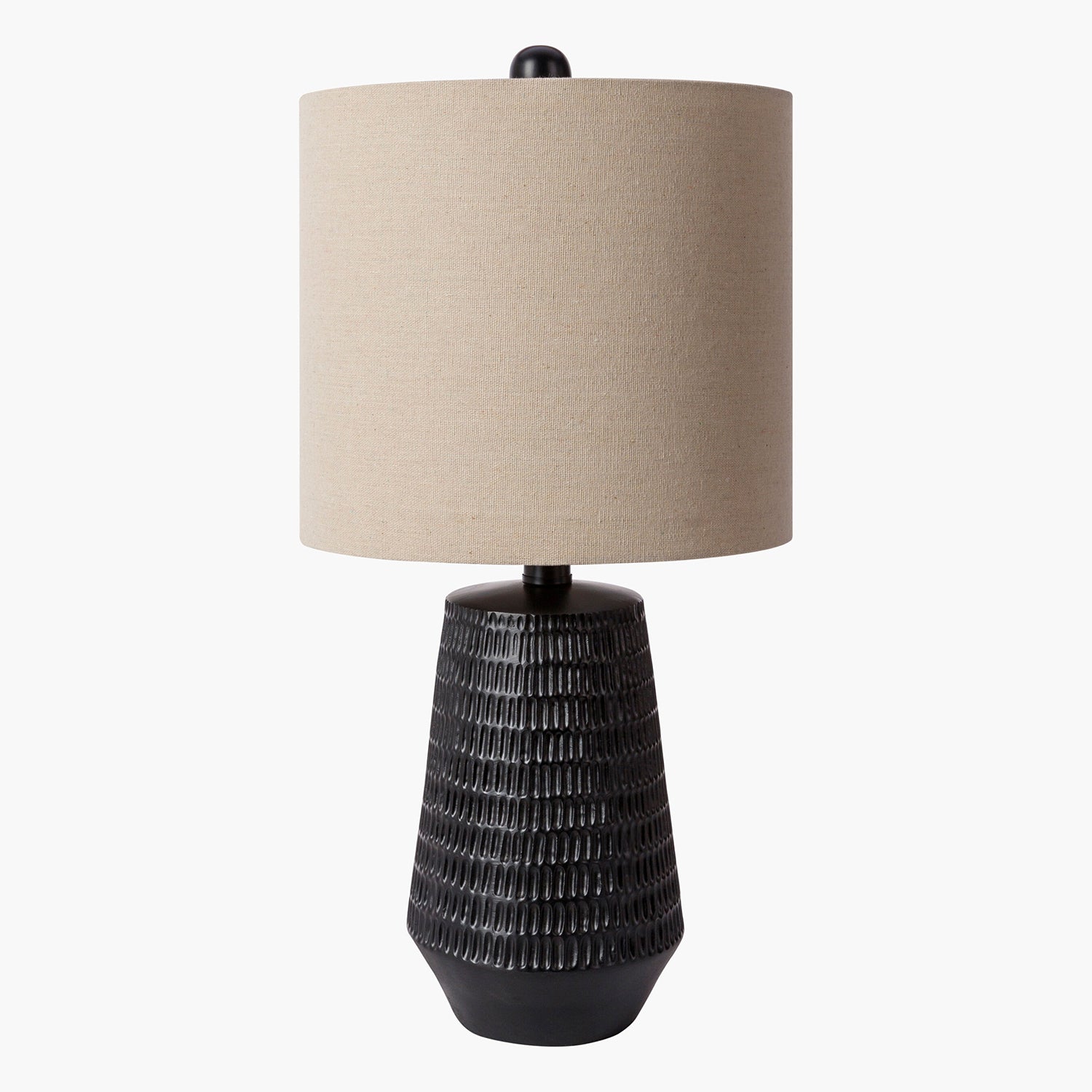 Table lamp with textured black base and beige lampshade on a white background