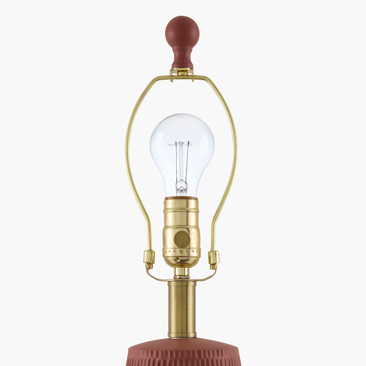 Vintage-style lamp with clear bulb on a white background