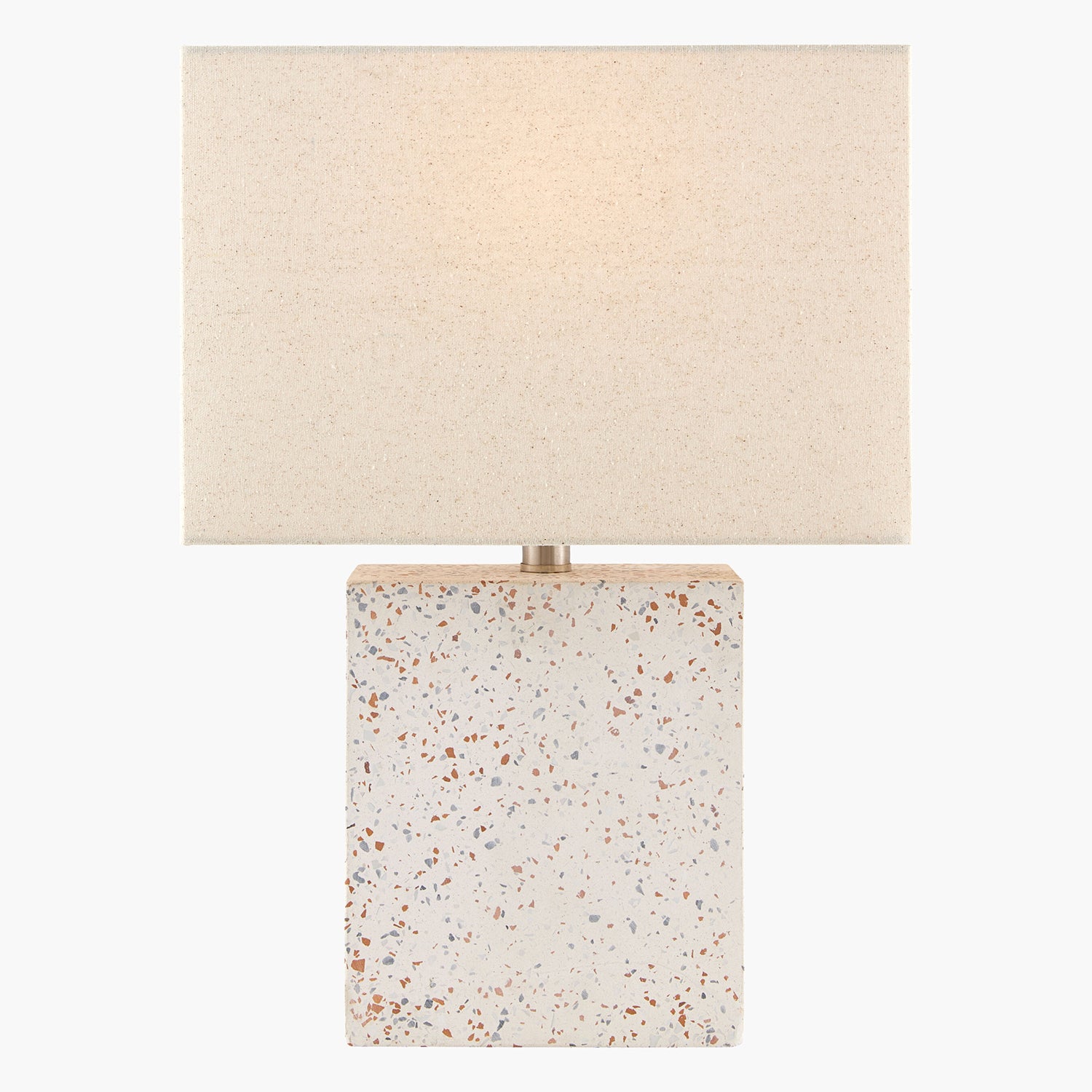 Table lamp with terrazzo base and beige fabric shade on a white background