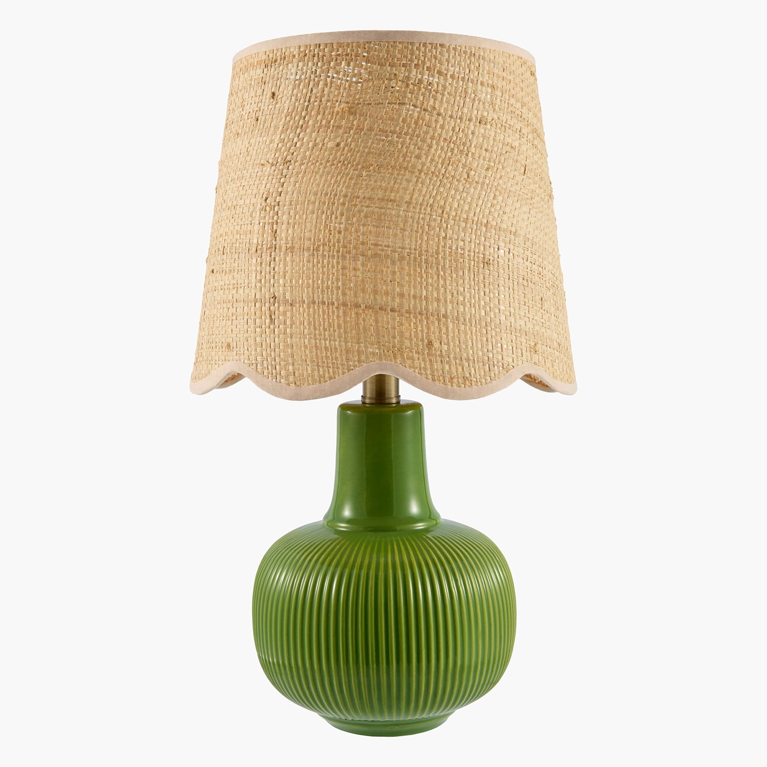 Green lamp with a textured base and beige woven shade on a white background