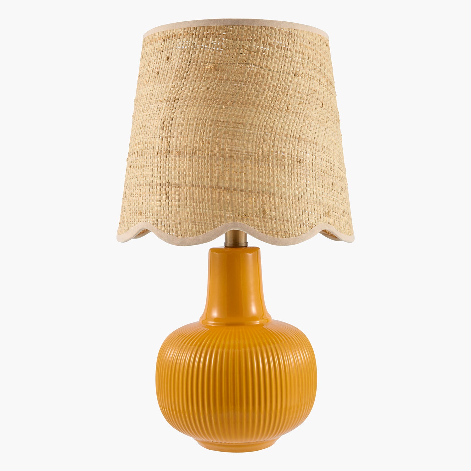 Yellow table lamp with a textured beige lampshade on a white background
