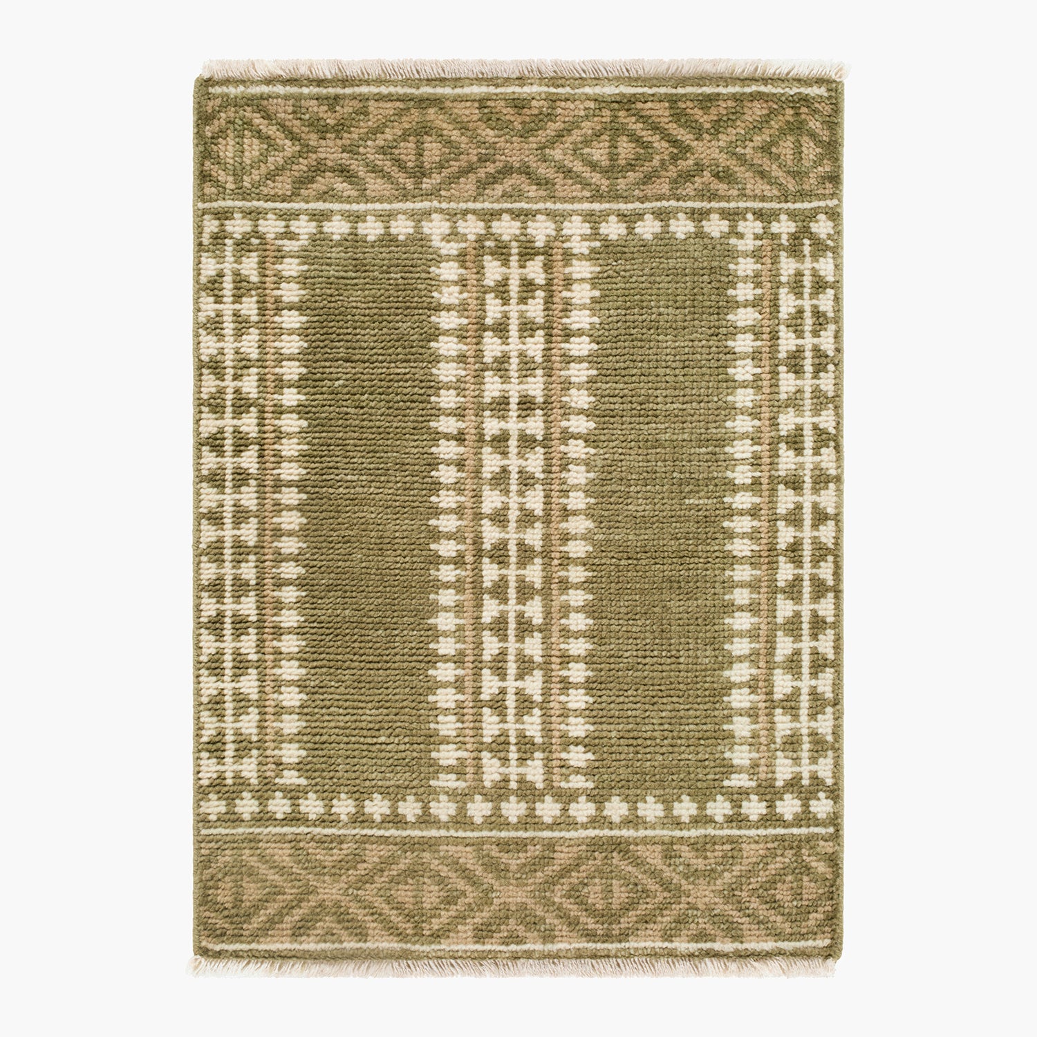Green and beige patterned rug on a white background