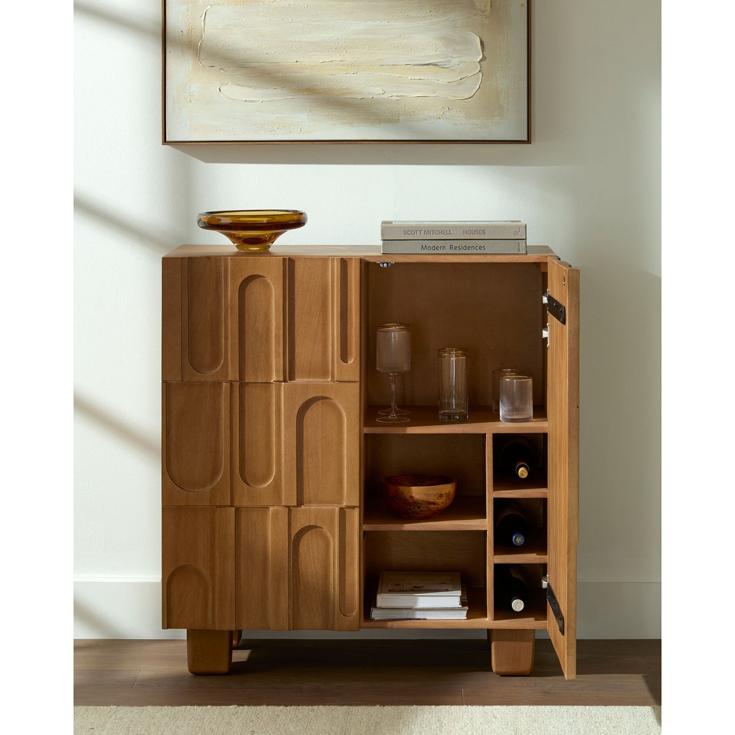 Wooden bar cabinet with decorative elements in a room setting