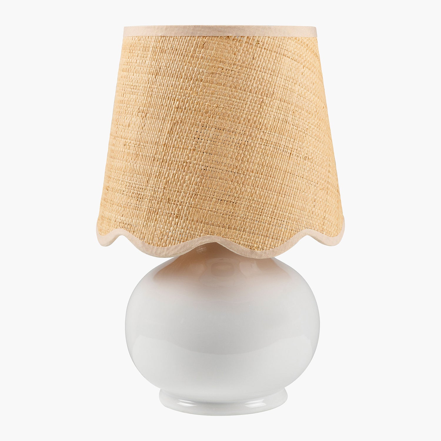 Table lamp with a white base and beige textured shade on a white background