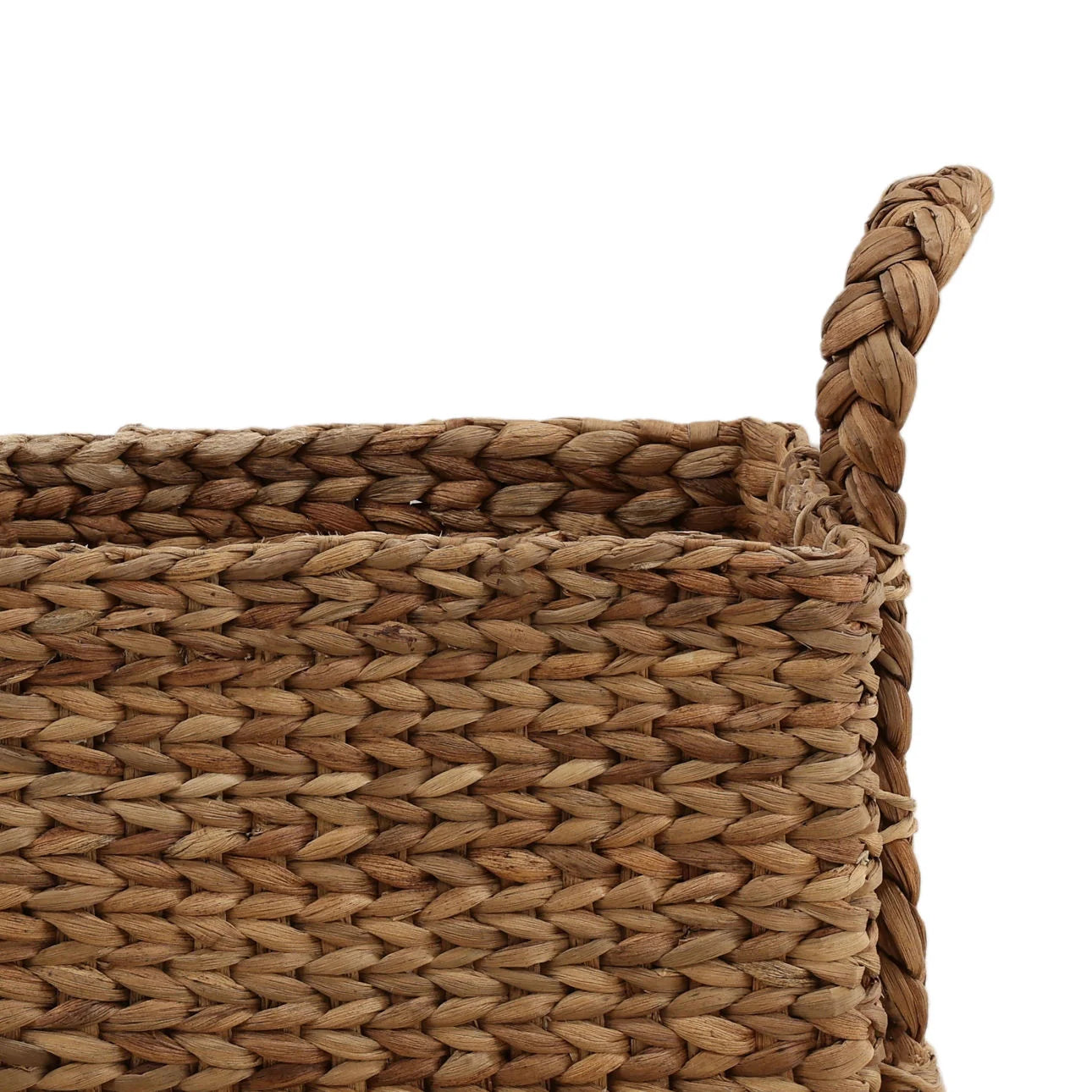 Close-up of a woven basket with a braided handle on a white background